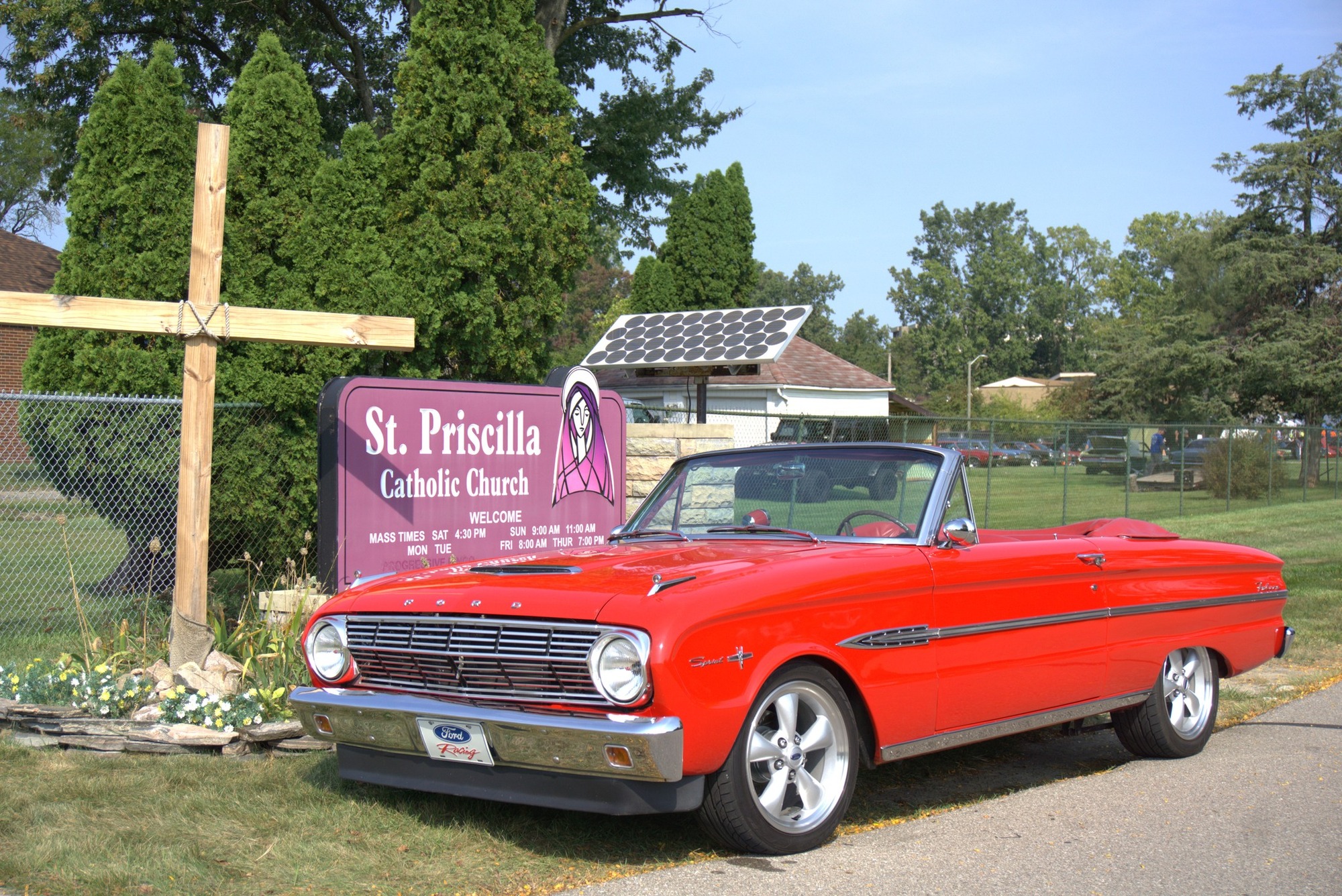 Sign indicating directions and information at the Classic Car Show.